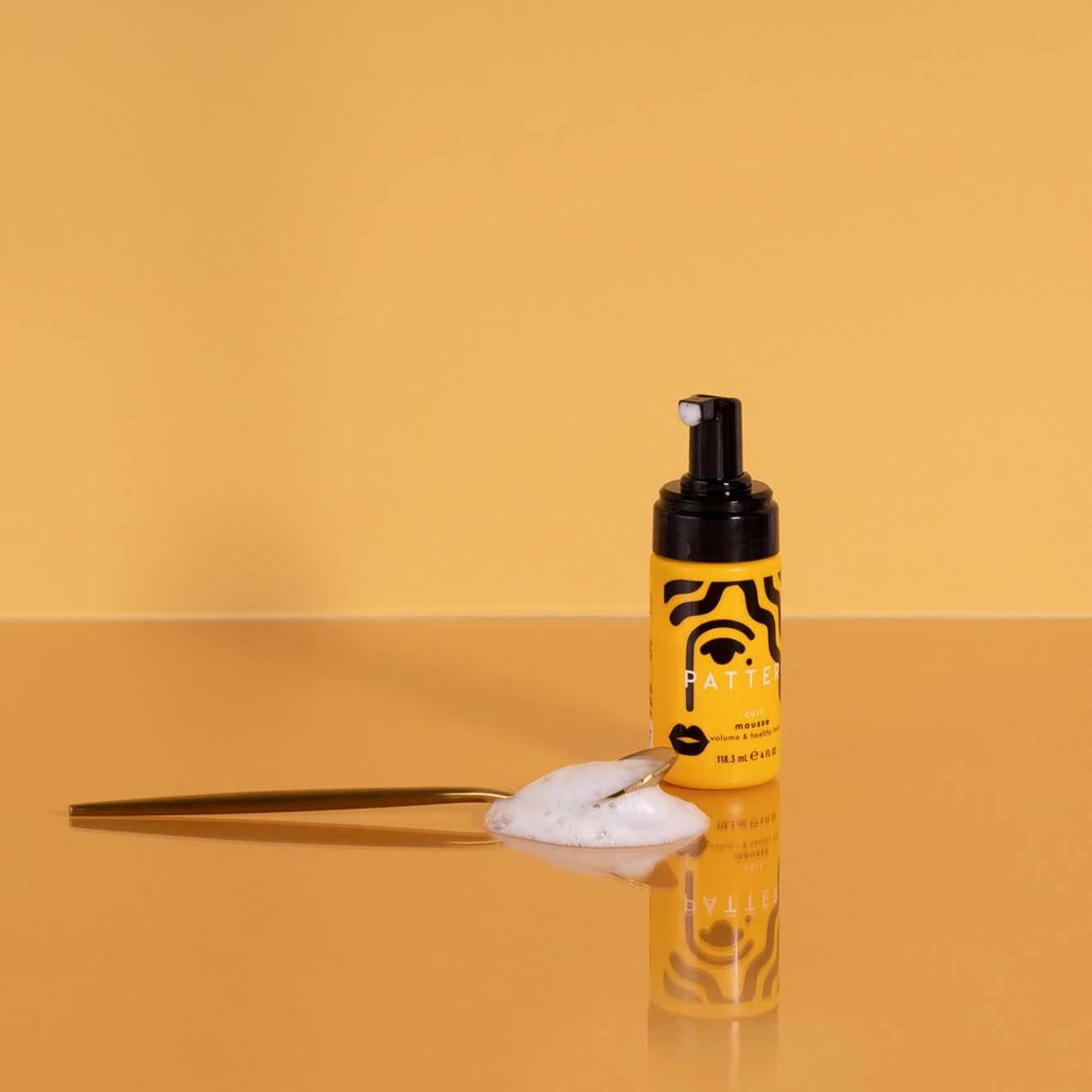 Pattern Beauty Curl Mousse bottle with pump dispenser, designed for defining and enhancing natural curly hair.