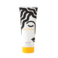Pattern Beauty Medium Conditioner for curly hair, hydrating and providing slip, in a sleek bottle with a pump dispenser.