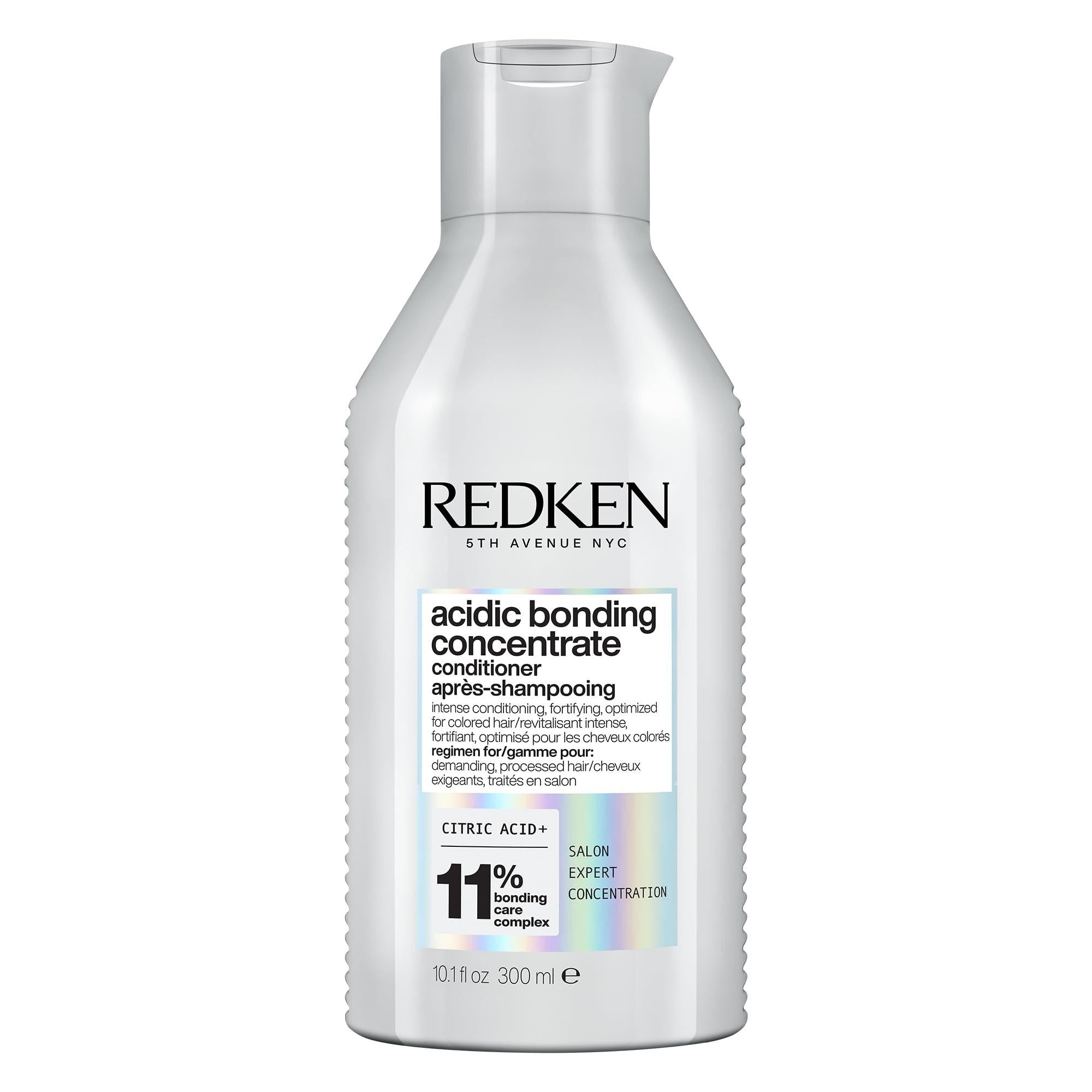Redken Acidic Bonding Concentrate conditioner for damaged hair repair, shown in a stylish bottle with a sleek design.