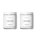 Herbivore Coconut Milk Bath Soak in a jar, featuring a creamy, textured bath product with coconut flakes and a relaxing spa setting.