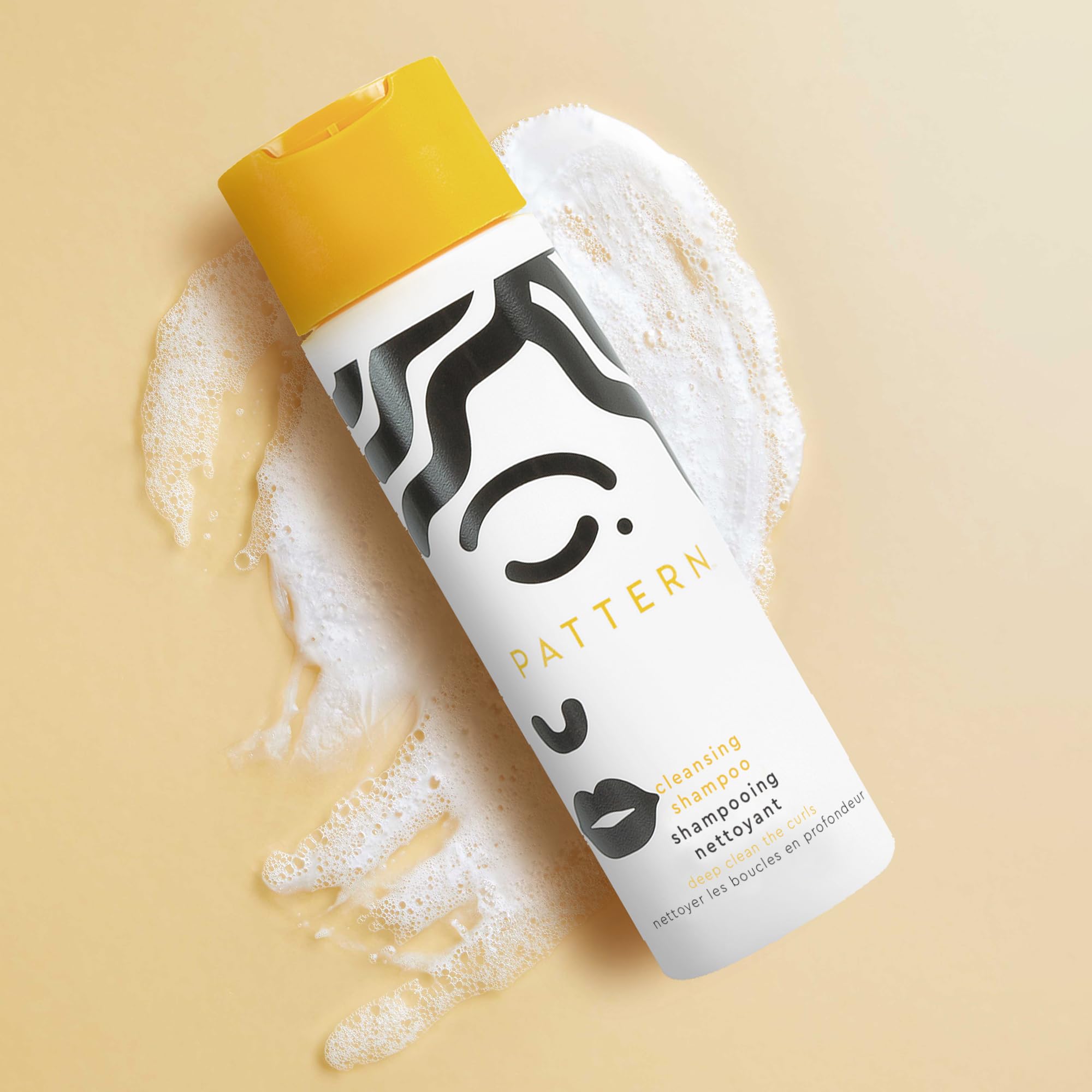 Pattern Beauty Cleansing Shampoo bottle with label, featuring a clear liquid and a pump dispenser for gentle hair cleansing.