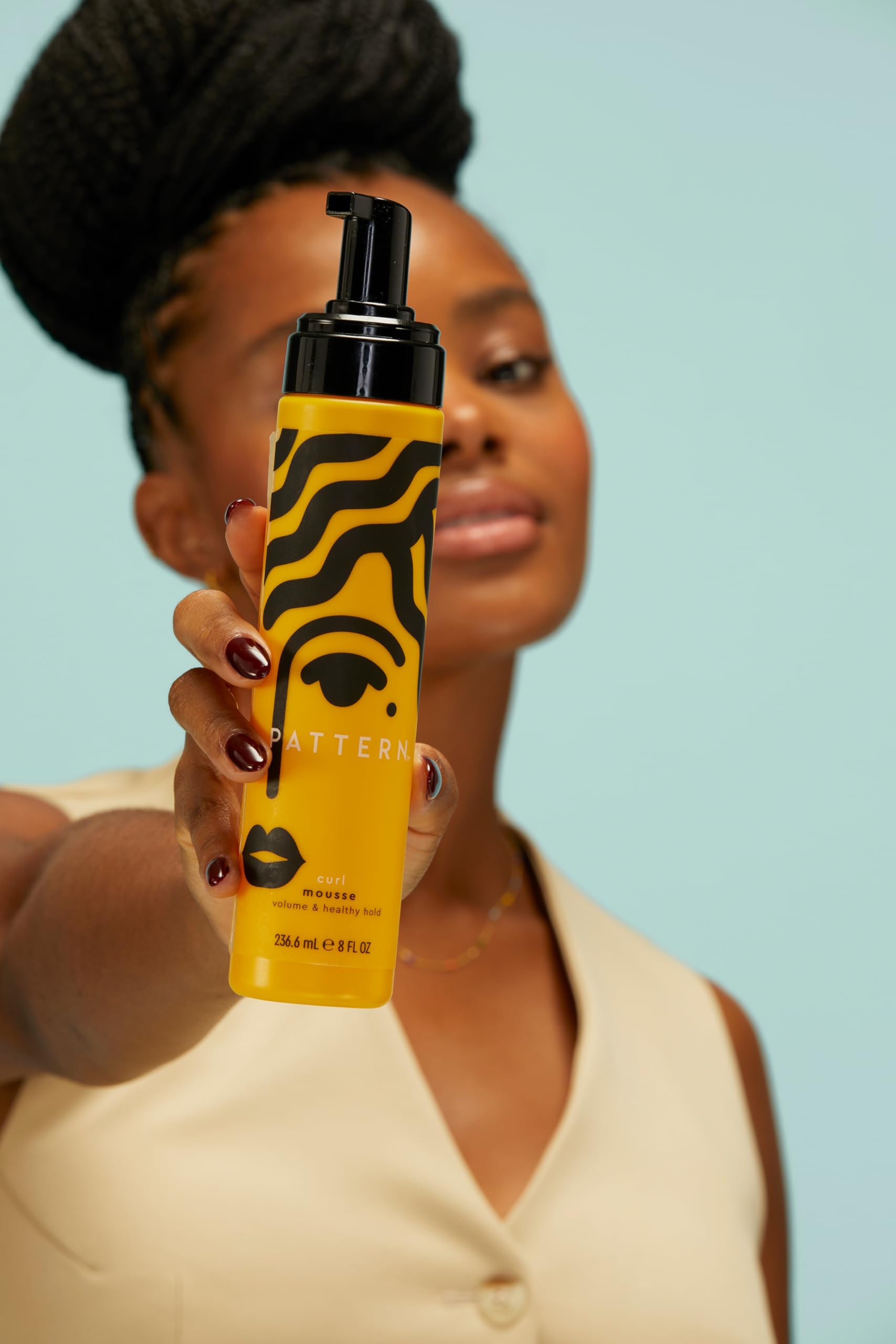 Pattern Beauty Curl Mousse by Tracee Ellis Ross in a pump bottle, designed for defining and enhancing curly hair.