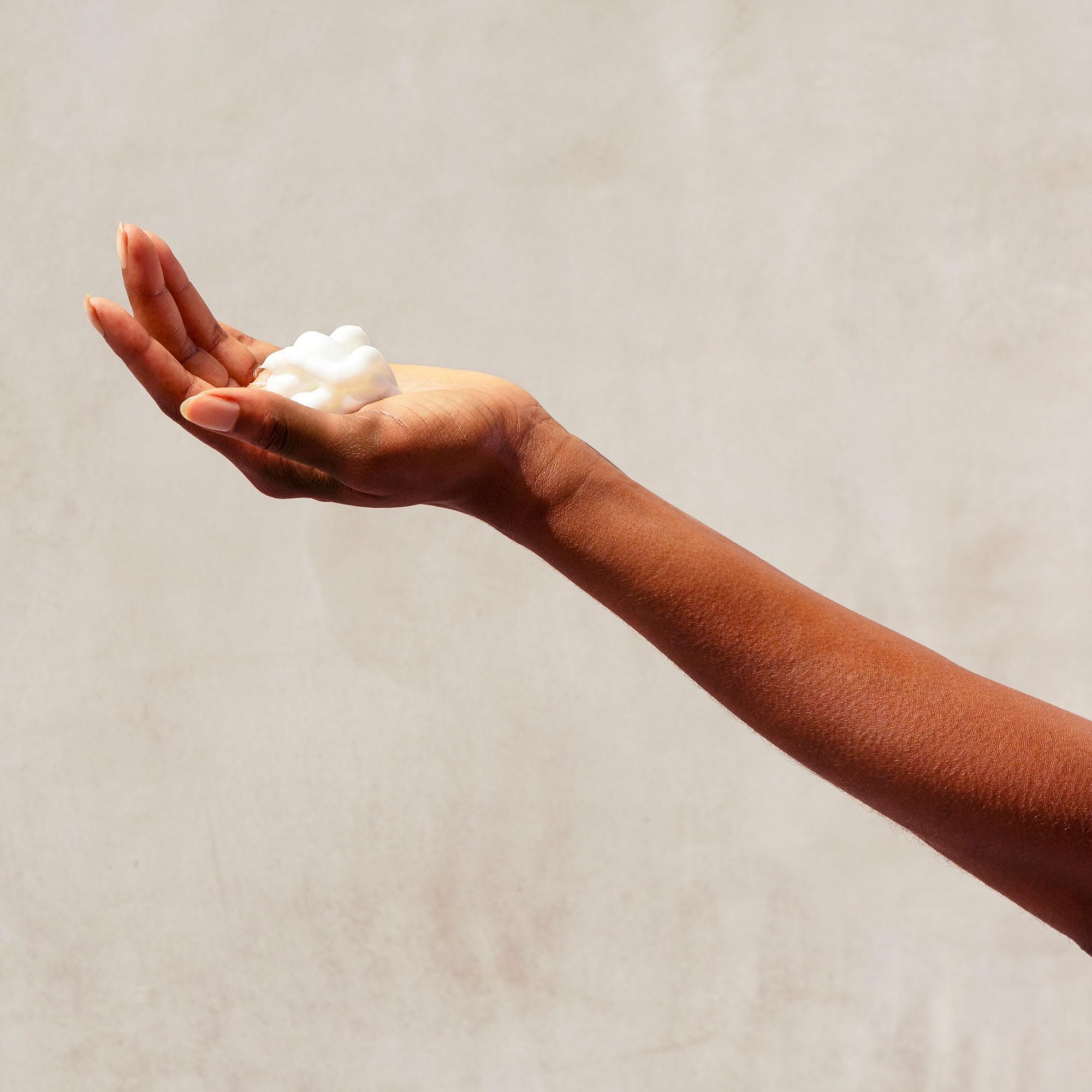 Pattern Beauty Medium Conditioner for curly hair, featuring hydrating formula with slip, in a sleek bottle with pump dispenser.