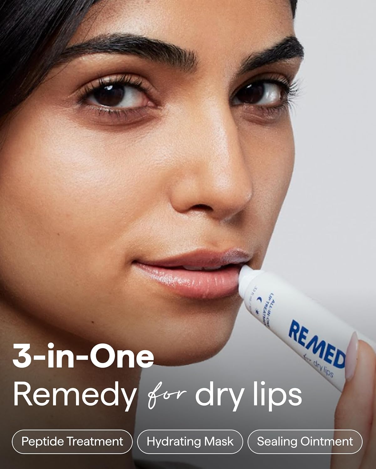 Remedy Science All-In-One Lip Treatment tube with applicator, moisturizing and nourishing for soft, healthy lips.