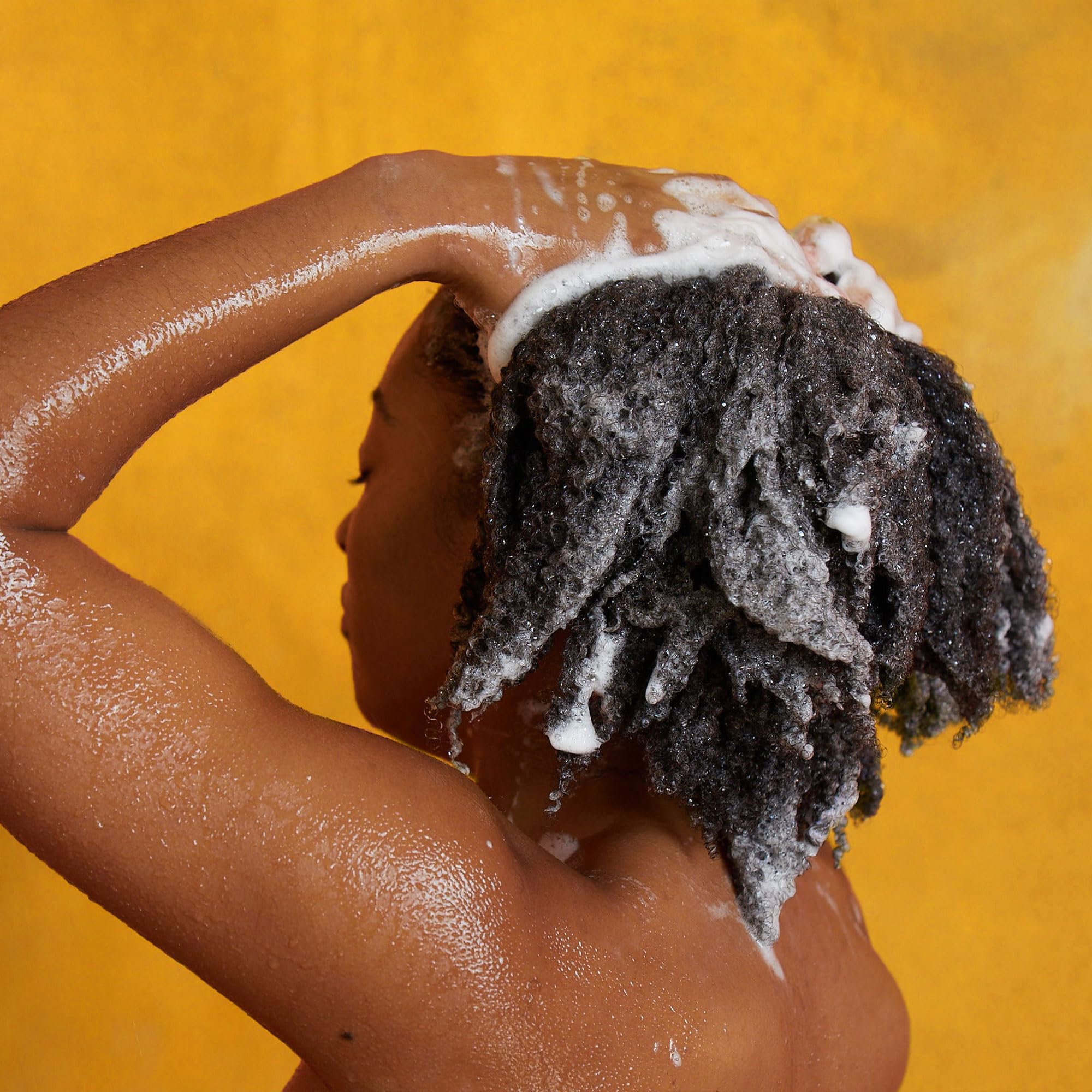 Pattern Beauty Hydration Shampoo bottle with label, featuring a clear plastic container and pump dispenser for curly hair hydration.