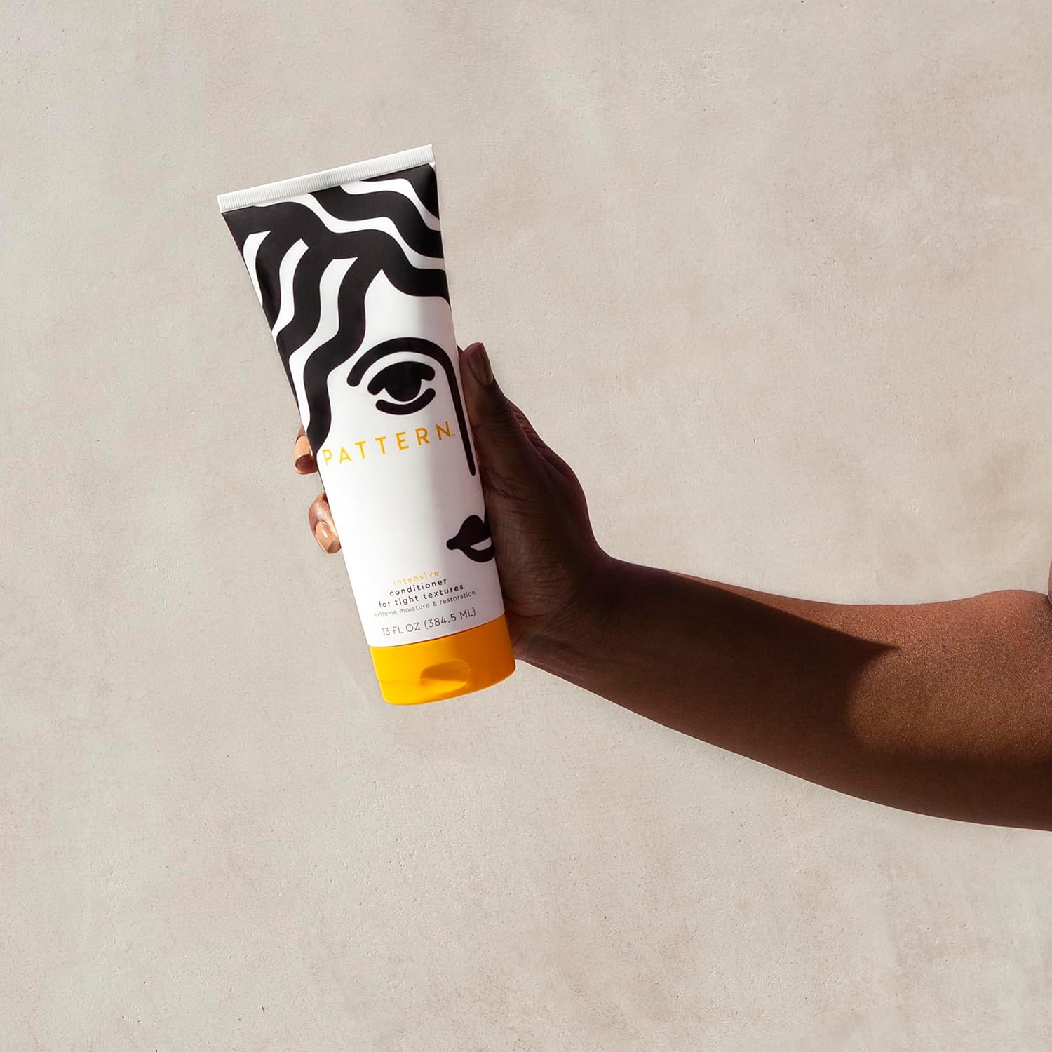 Pattern Beauty Intensive Conditioner bottle with pump, a nourishing hair conditioner for textured and curly hair.
