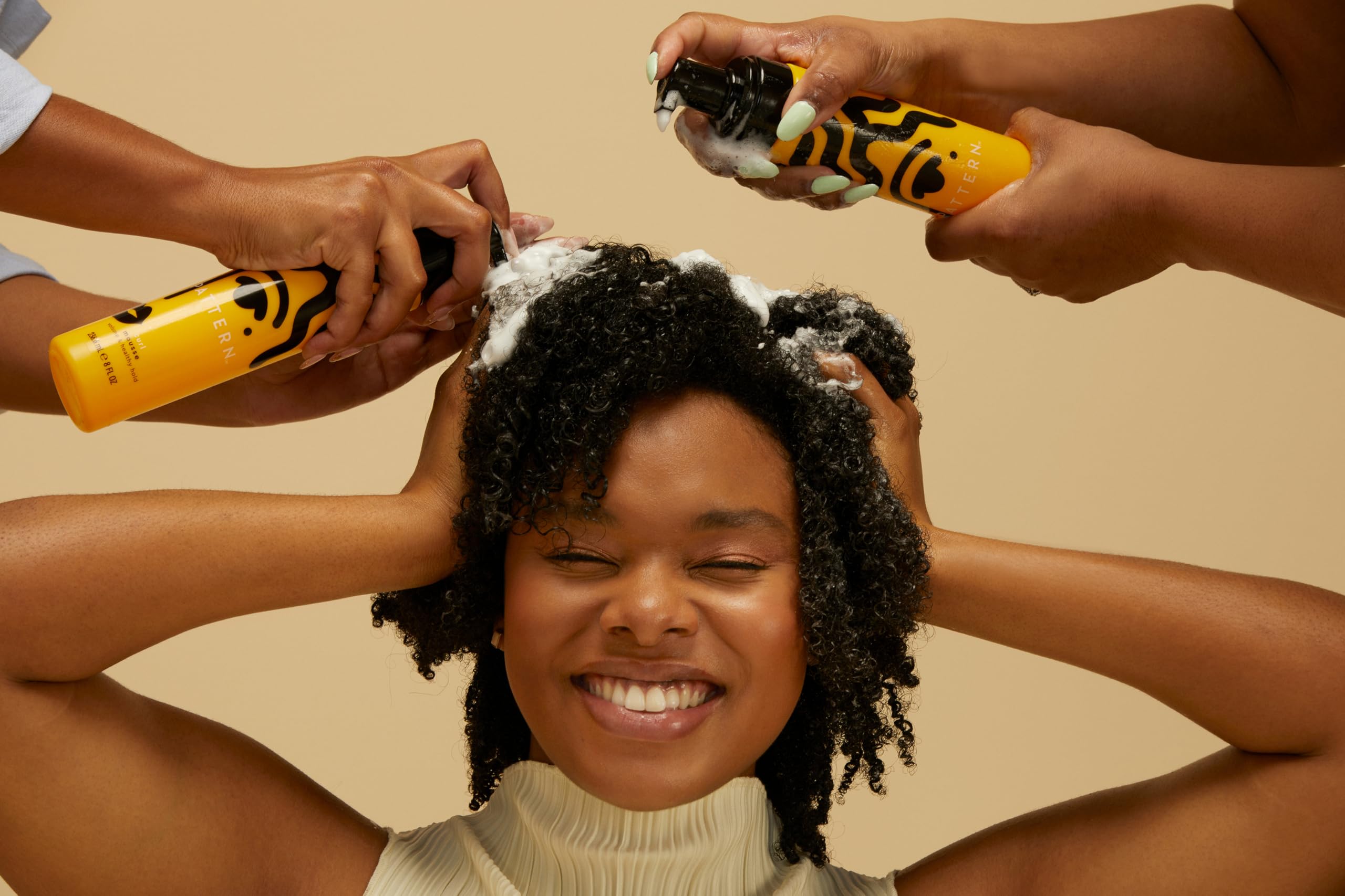 Pattern Beauty Curl Mousse in a bottle with a pump dispenser, designed for defining and enhancing natural curls.