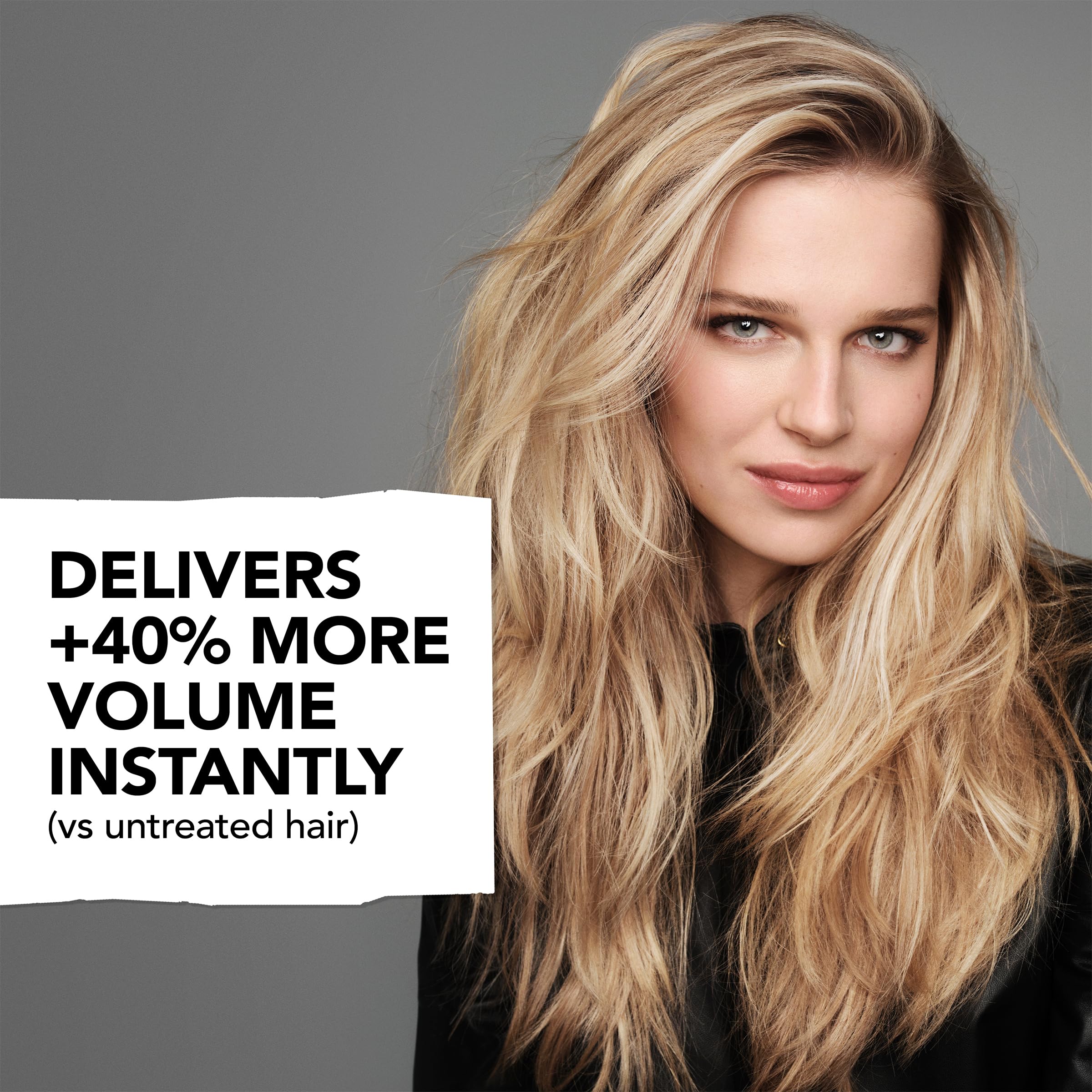 Bumble & Bumble Thickening Dryspun Texture Spray bottle with spray nozzle, designed to add volume and texture to hair.